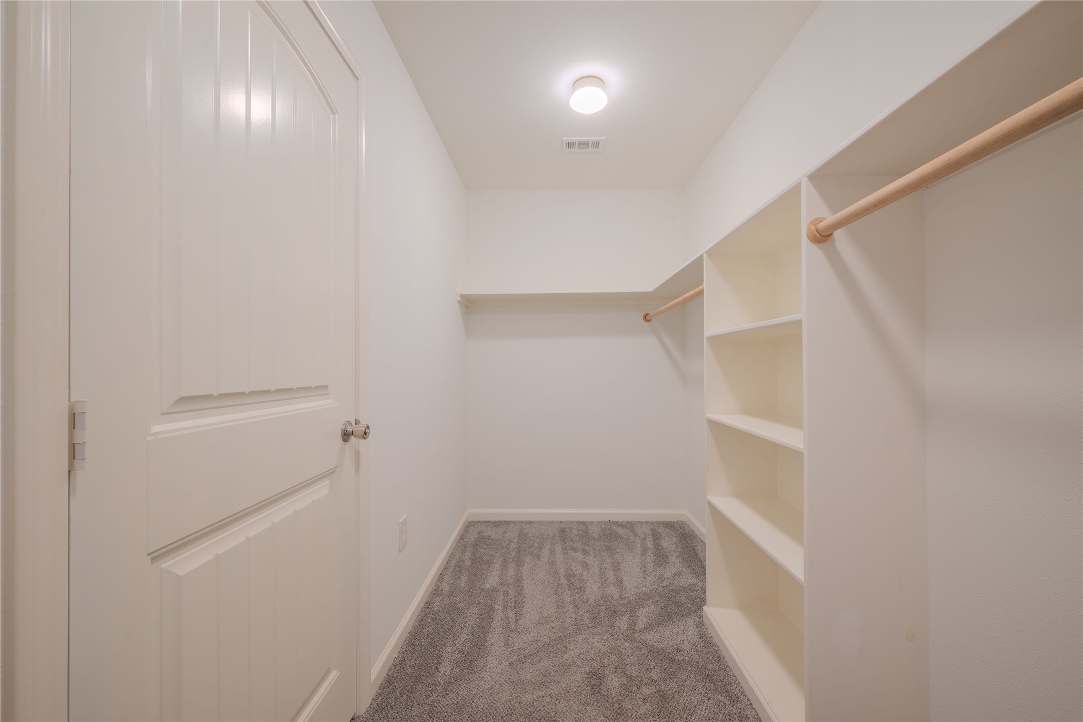 4340 Highway 60 Wharton, TX 77488 - Photo 33 of 49 This deep full-entry closet is outfitted with a sophisticated array of built-in shelving and integrated hanging rods for the ultimate organizational experience.