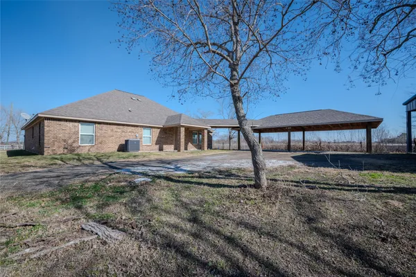 a house with trees in the background