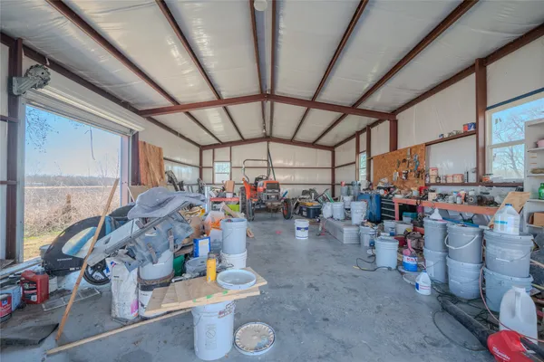 a view of a storage room with water heater and racks