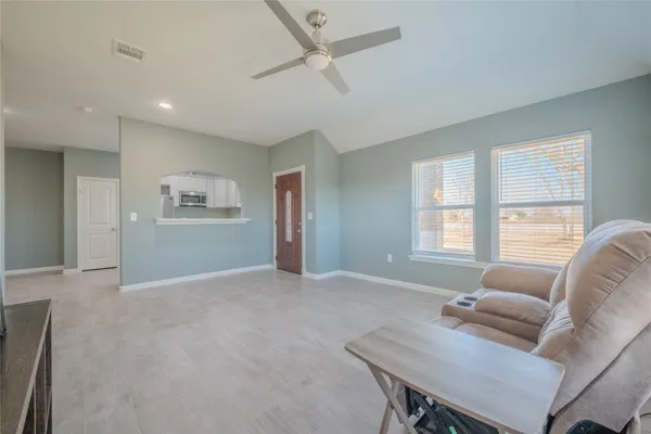 a living room with furniture and a window