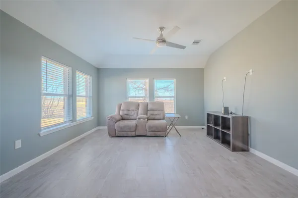 a living room with furniture and windows