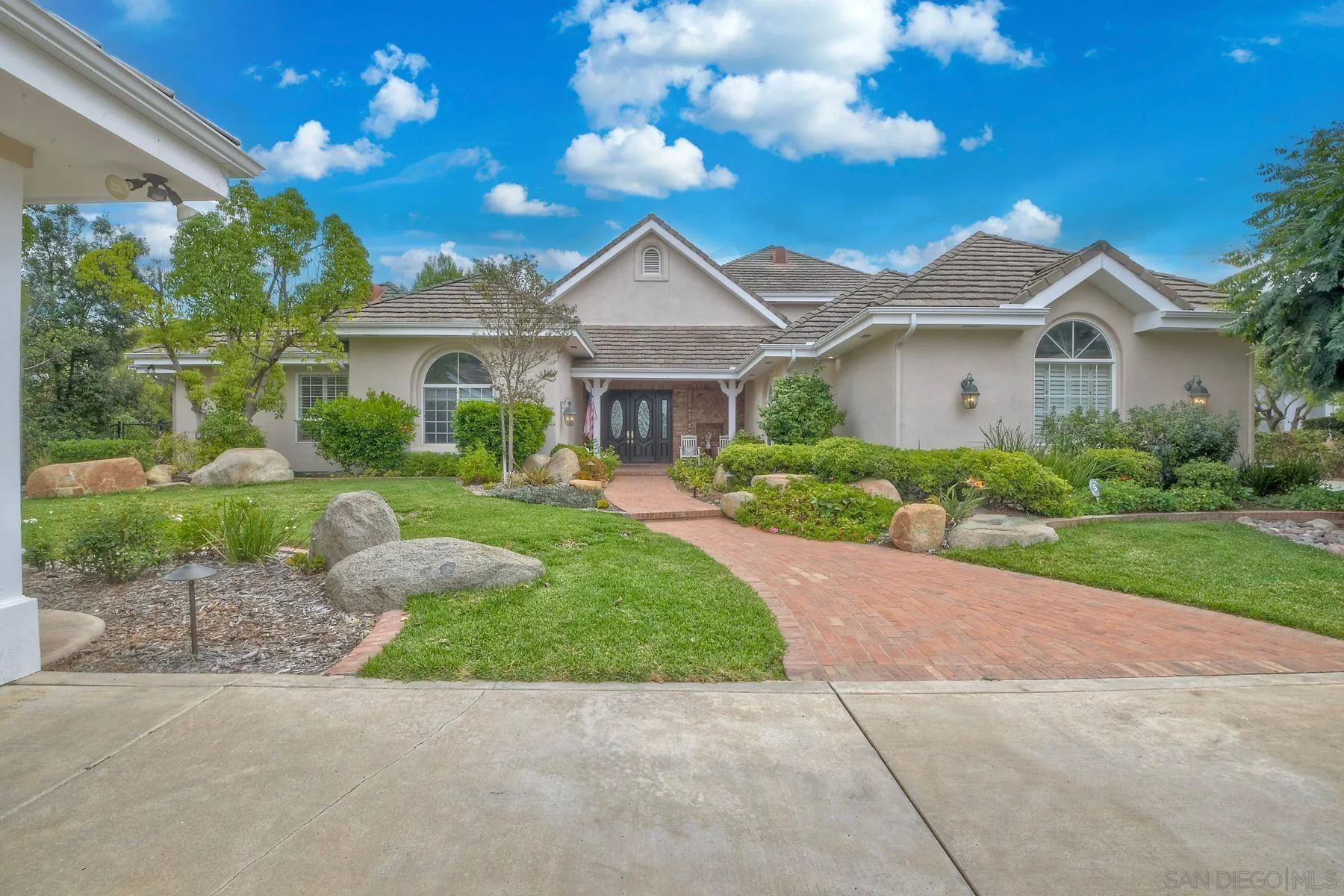 a front view of a house with yard