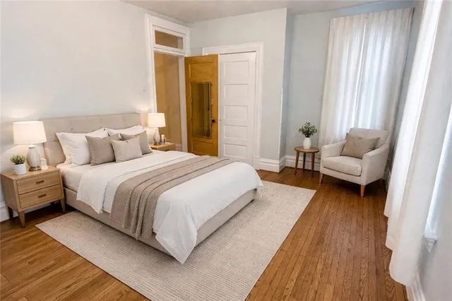 a bedroom with a bed and a couch