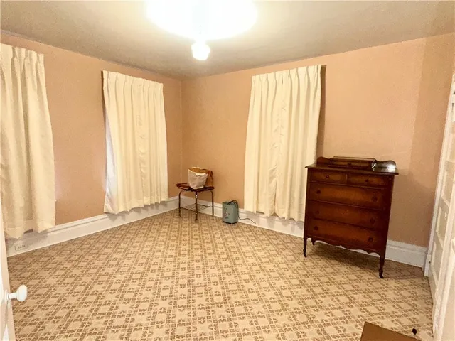a living room with a furniture and a window