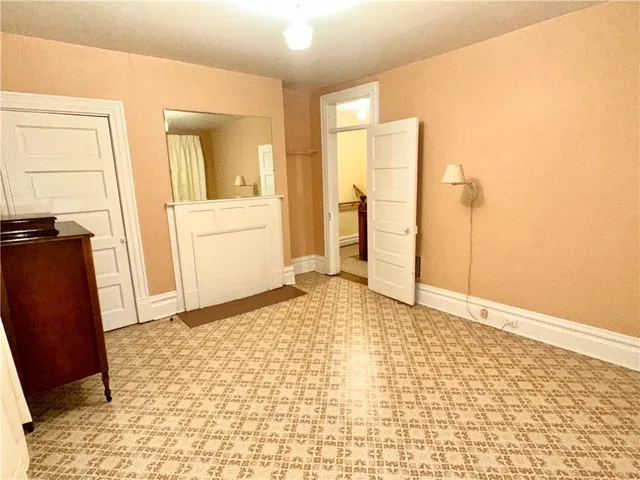 a living room with a fireplace furniture and a window