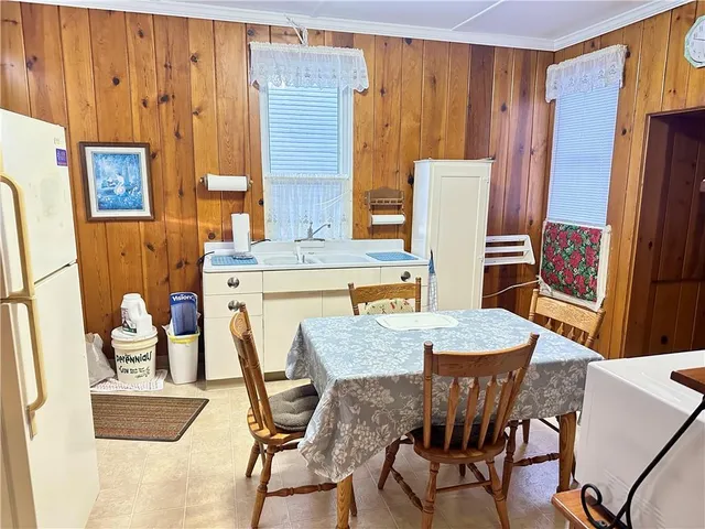 a view of a dining room with furniture and window