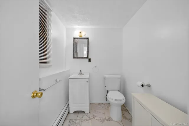 a bathroom with a toilet and a sink