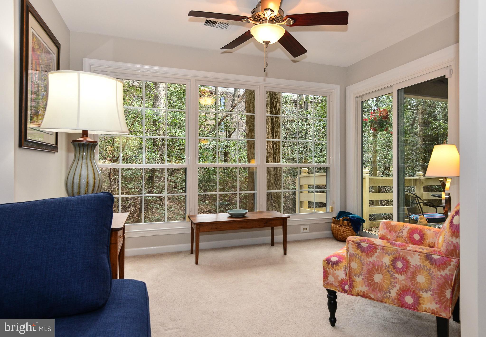 2217 Lovedale Lane, Unit C Reston, VA 20191 - Photo 2 of 37 Sunroom with treed view