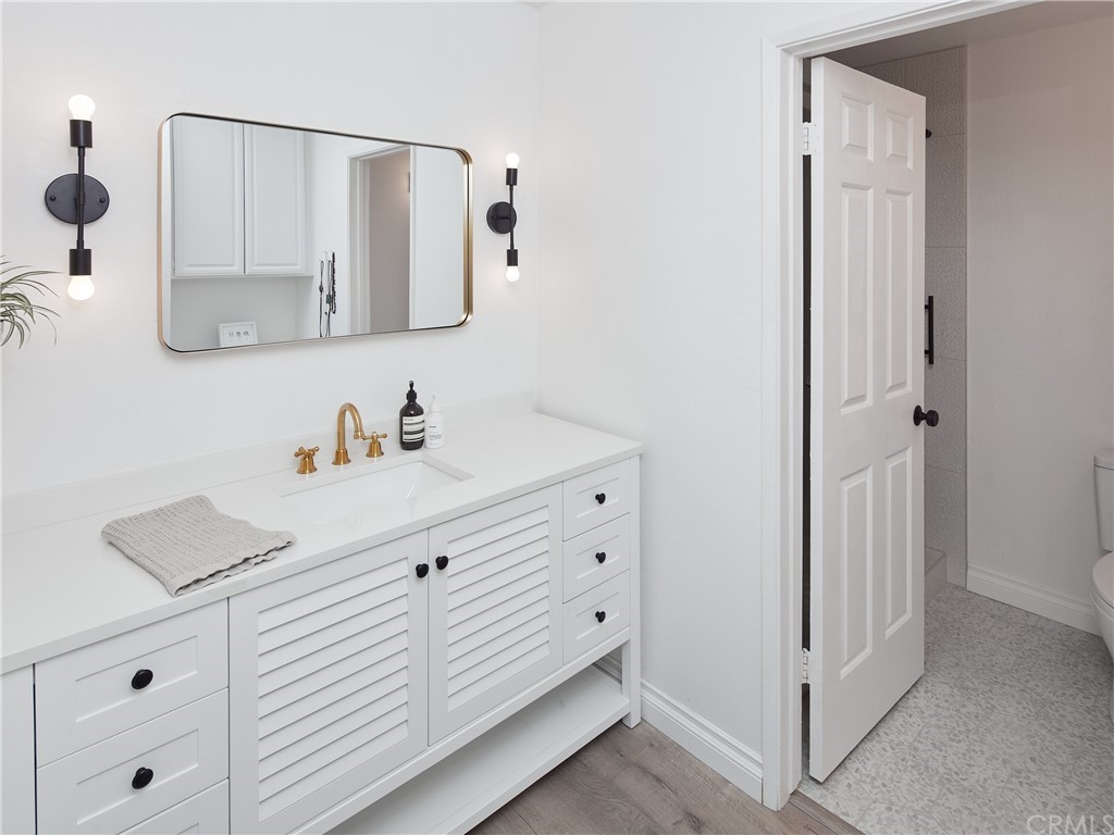 356 Virginia Street, Unit 202 El Segundo, CA 90245 - Photo 12 of 22 a bathroom with a sink and a mirror