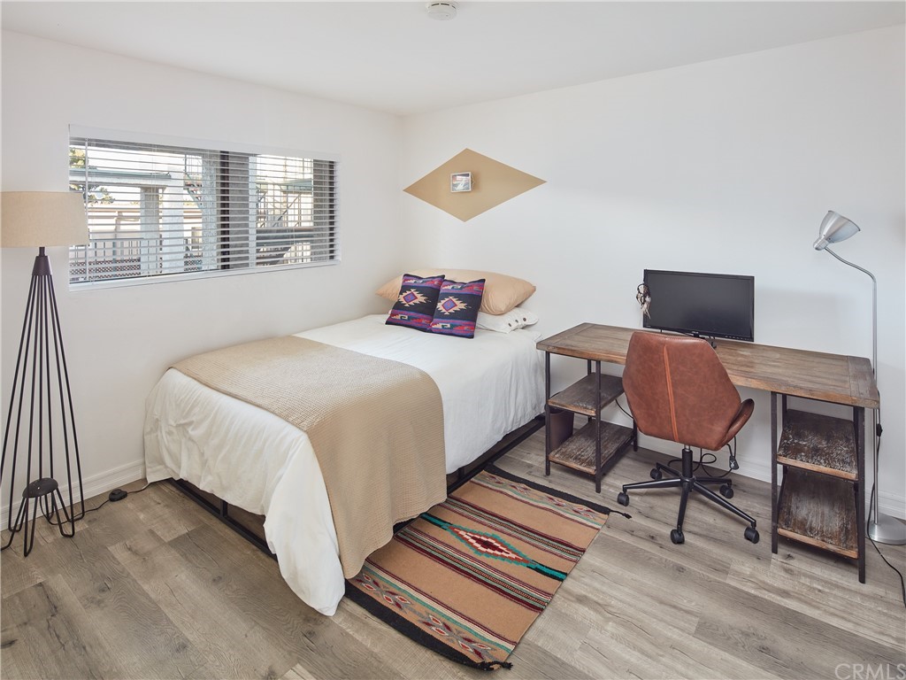 356 Virginia Street, Unit 202 El Segundo, CA 90245 - Photo 15 of 22 a bedroom with a bed and wooden floor