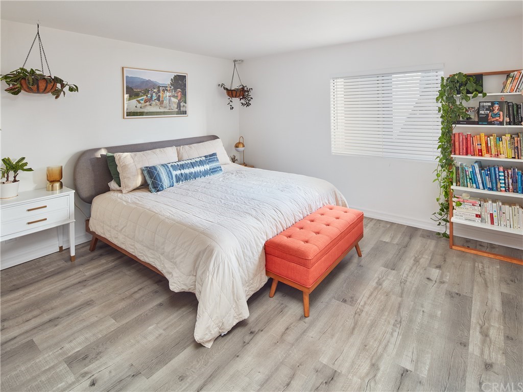 356 Virginia Street, Unit 202 El Segundo, CA 90245 - Photo 10 of 22 a bedroom with bed and wooden floor