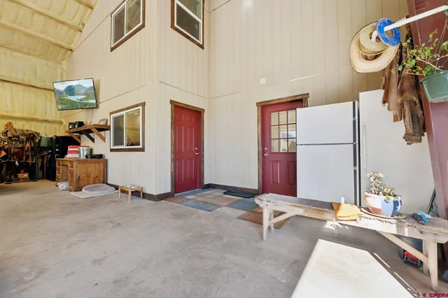 a view of a livingroom with furniture and a window
