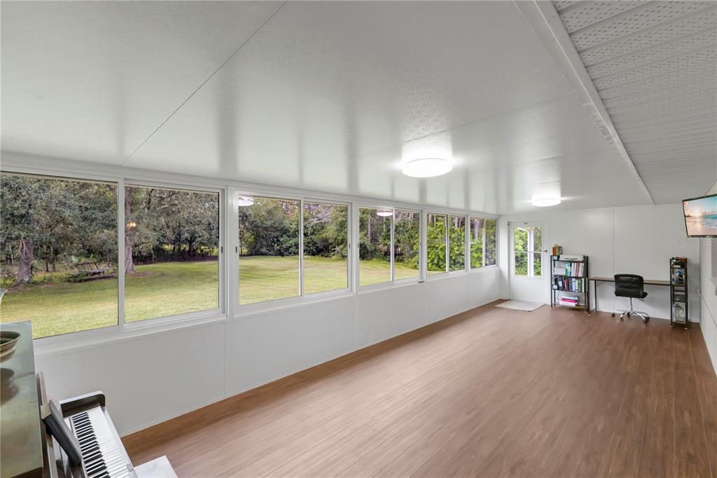 396 North Post Office Road Kenansville, FL 34739 - Photo 19 of 34 a view of an empty room with windows