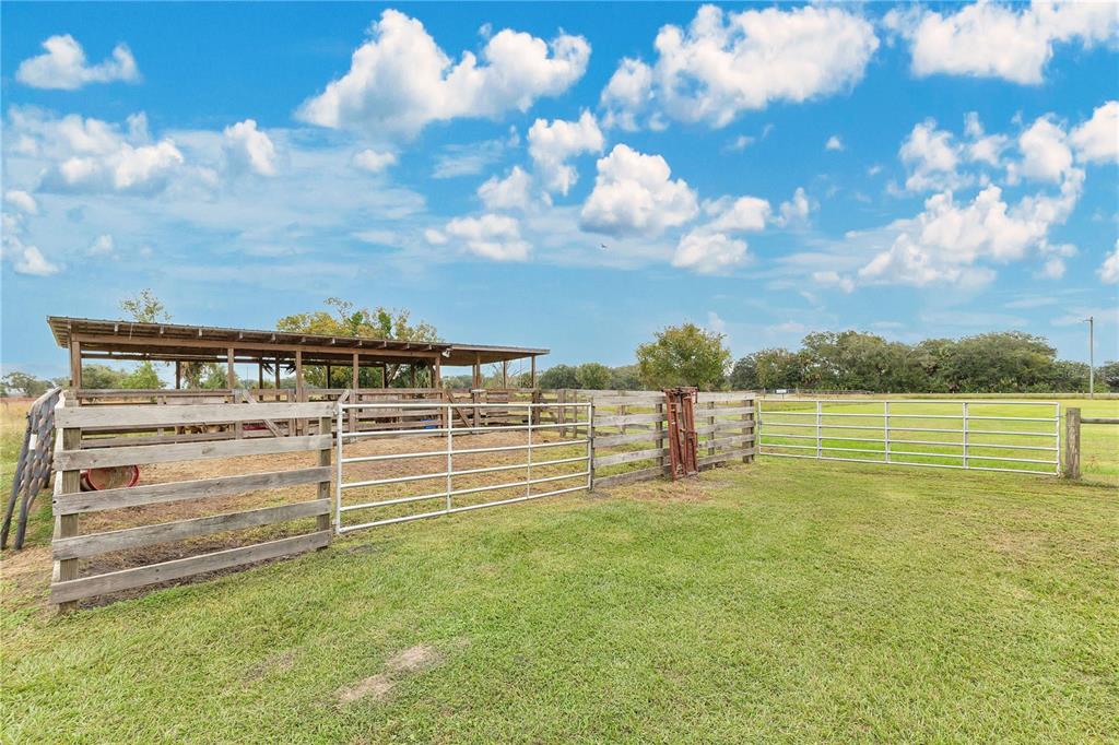 396 North Post Office Road Kenansville, FL 34739 - Photo 26 of 34 a view of a water with an outdoor seating
