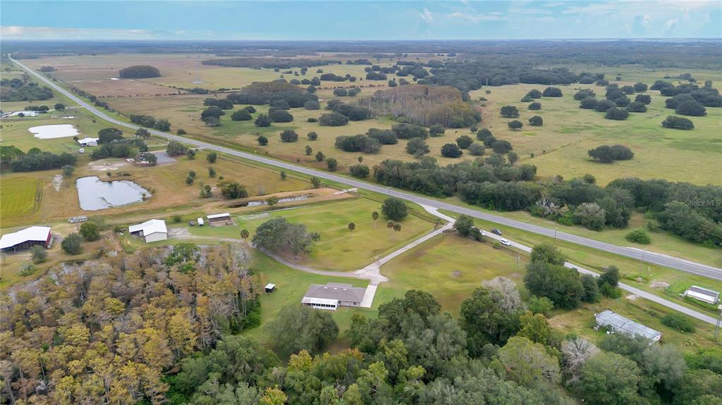 396 North Post Office Road Kenansville, FL 34739 - Photo 31 of 34 an aerial view of a residential houses with outdoor space and swimming pool