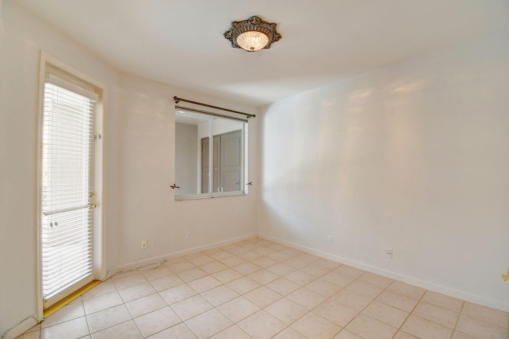 20710 Northwest 29th Avenue Boca Raton, FL 33434 - Photo 14 of 35 a view of an empty room with a window