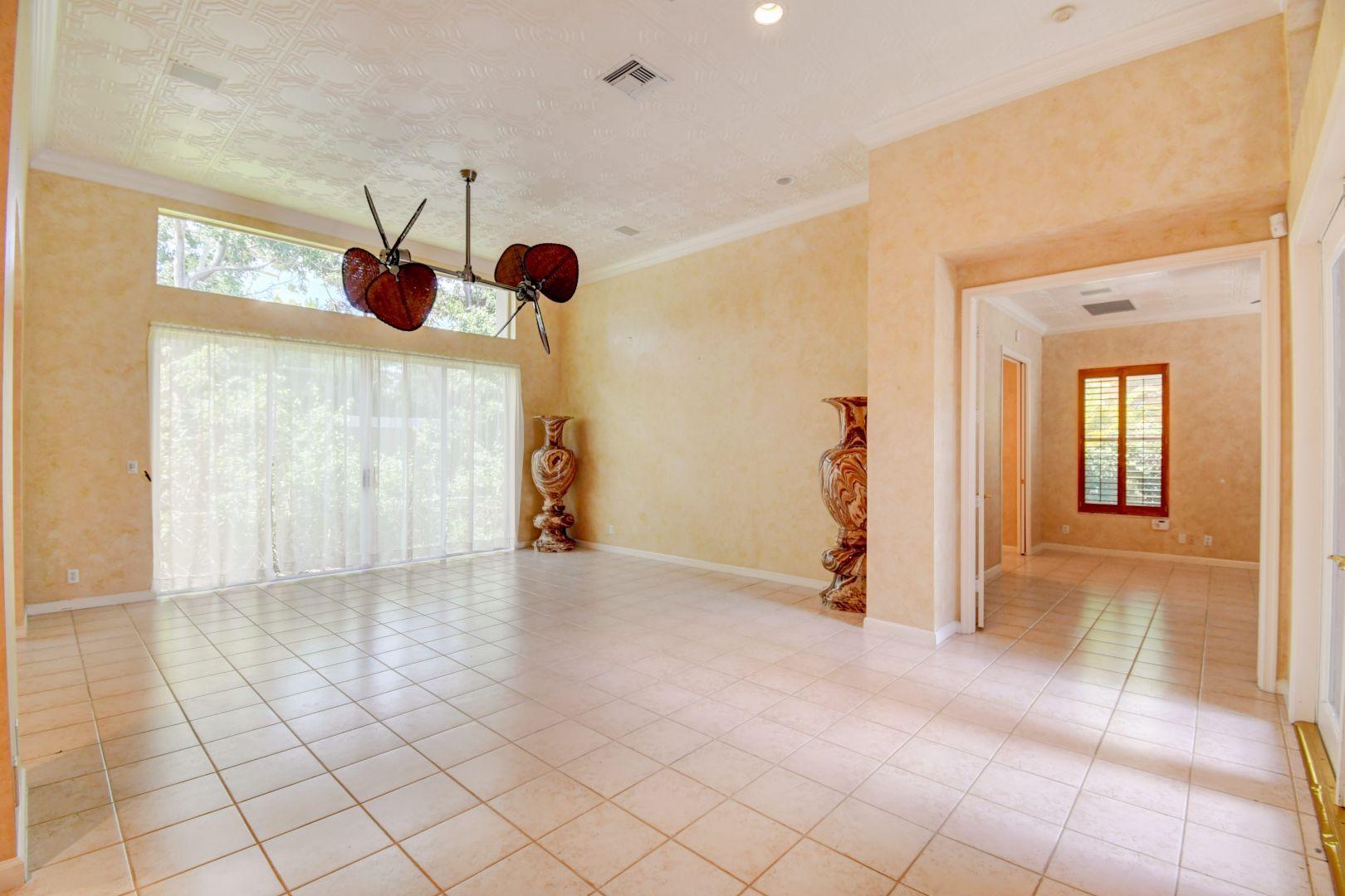 20710 Northwest 29th Avenue Boca Raton, FL 33434 - Photo 17 of 35 a view of a livingroom with wooden floor and a large window
