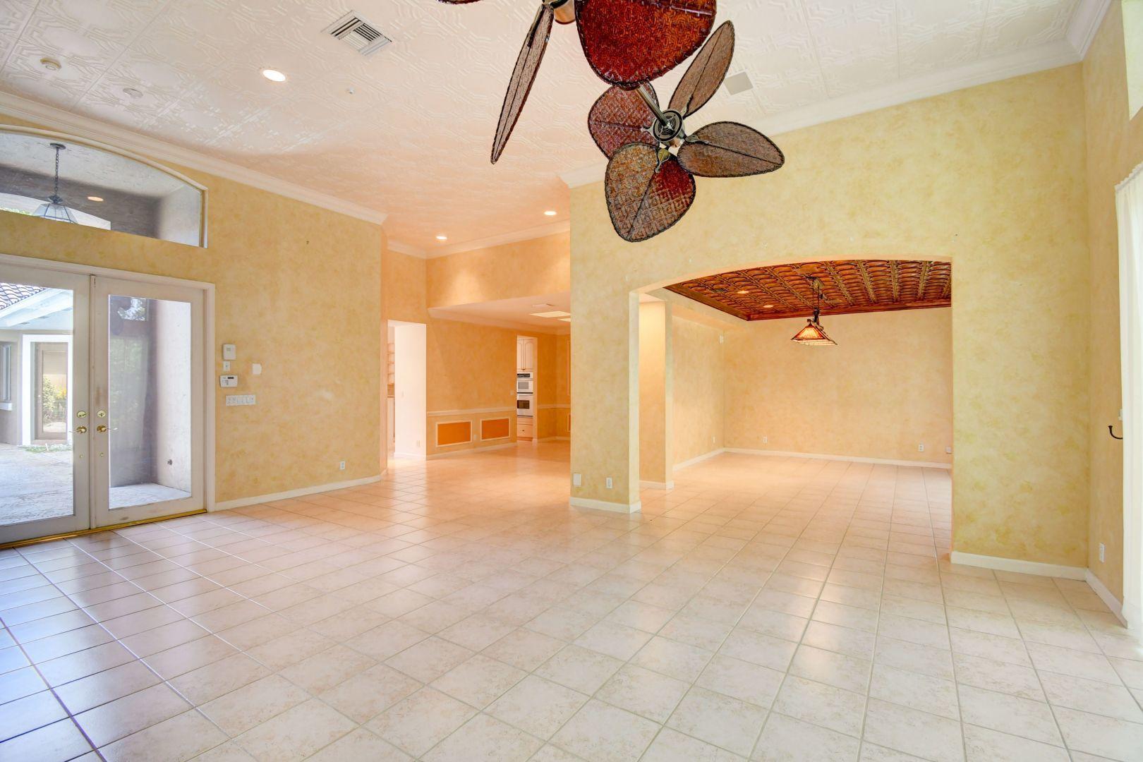 20710 Northwest 29th Avenue Boca Raton, FL 33434 - Photo 18 of 35 a view of an empty room with a chandelier fan