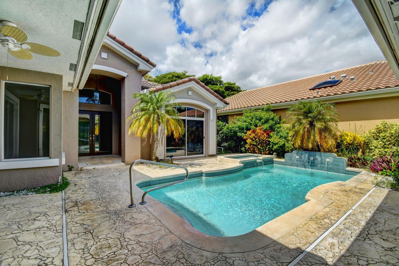 20710 Northwest 29th Avenue Boca Raton, FL 33434 - Photo 2 of 35 a view of a house with backyard porch and sitting area
