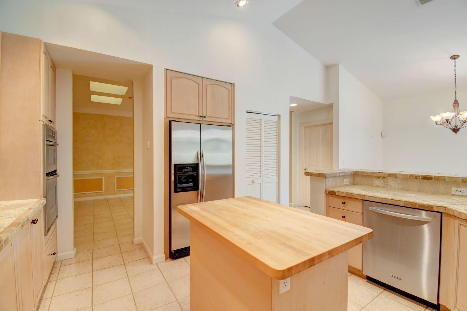 20710 Northwest 29th Avenue Boca Raton, FL 33434 - Photo 26 of 35 a kitchen with a stove a refrigerator and a sink