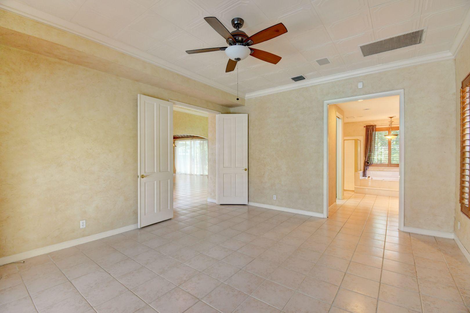 20710 Northwest 29th Avenue Boca Raton, FL 33434 - Photo 28 of 35 a view of an empty room and a ceiling fan