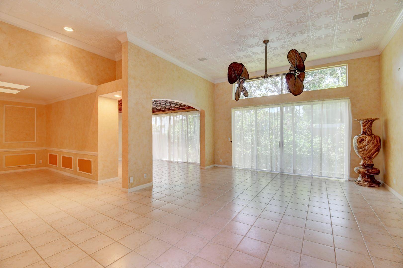 20710 Northwest 29th Avenue Boca Raton, FL 33434 - Photo 3 of 35 a view of empty room with window and fireplace