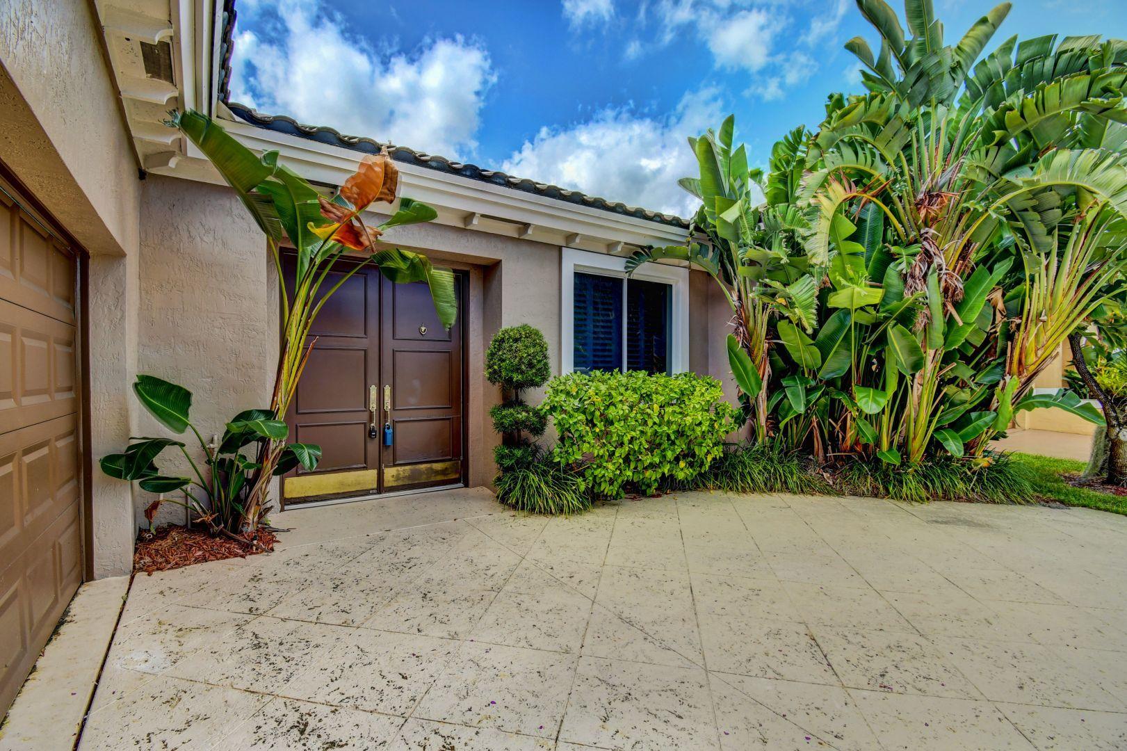 20710 Northwest 29th Avenue Boca Raton, FL 33434 - Photo 31 of 35 a view of a house with potted plants