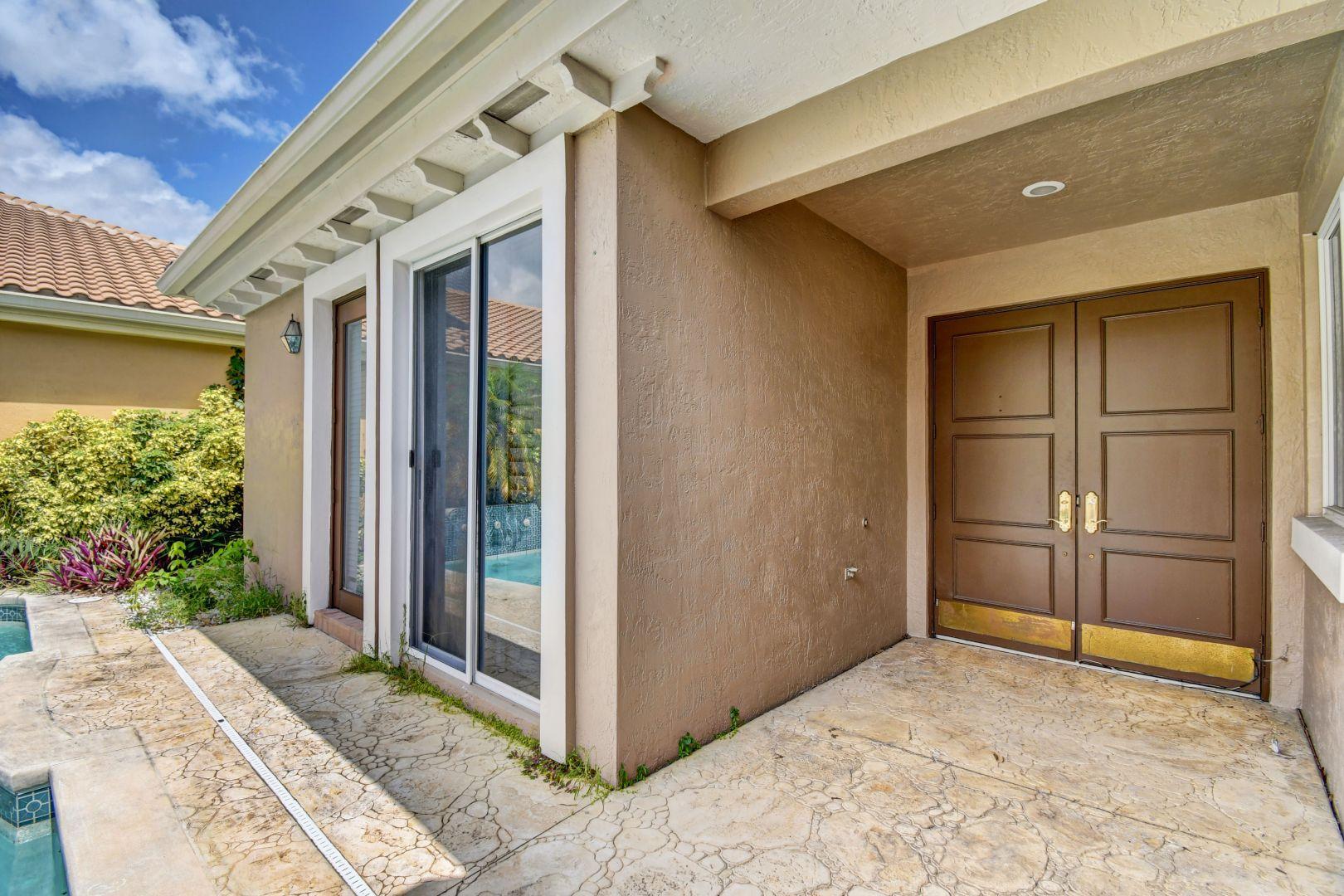 20710 Northwest 29th Avenue Boca Raton, FL 33434 - Photo 32 of 35 a view of an entrance of the house