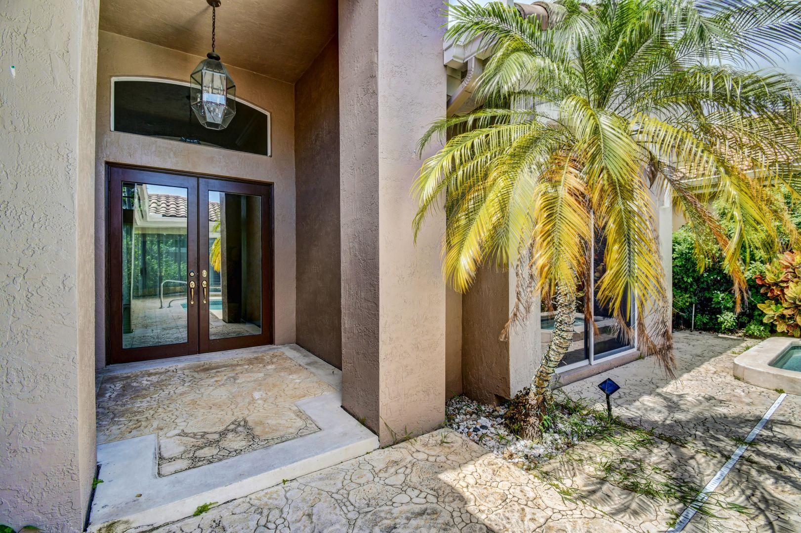 20710 Northwest 29th Avenue Boca Raton, FL 33434 - Photo 35 of 35 a view of a entryway door of the house