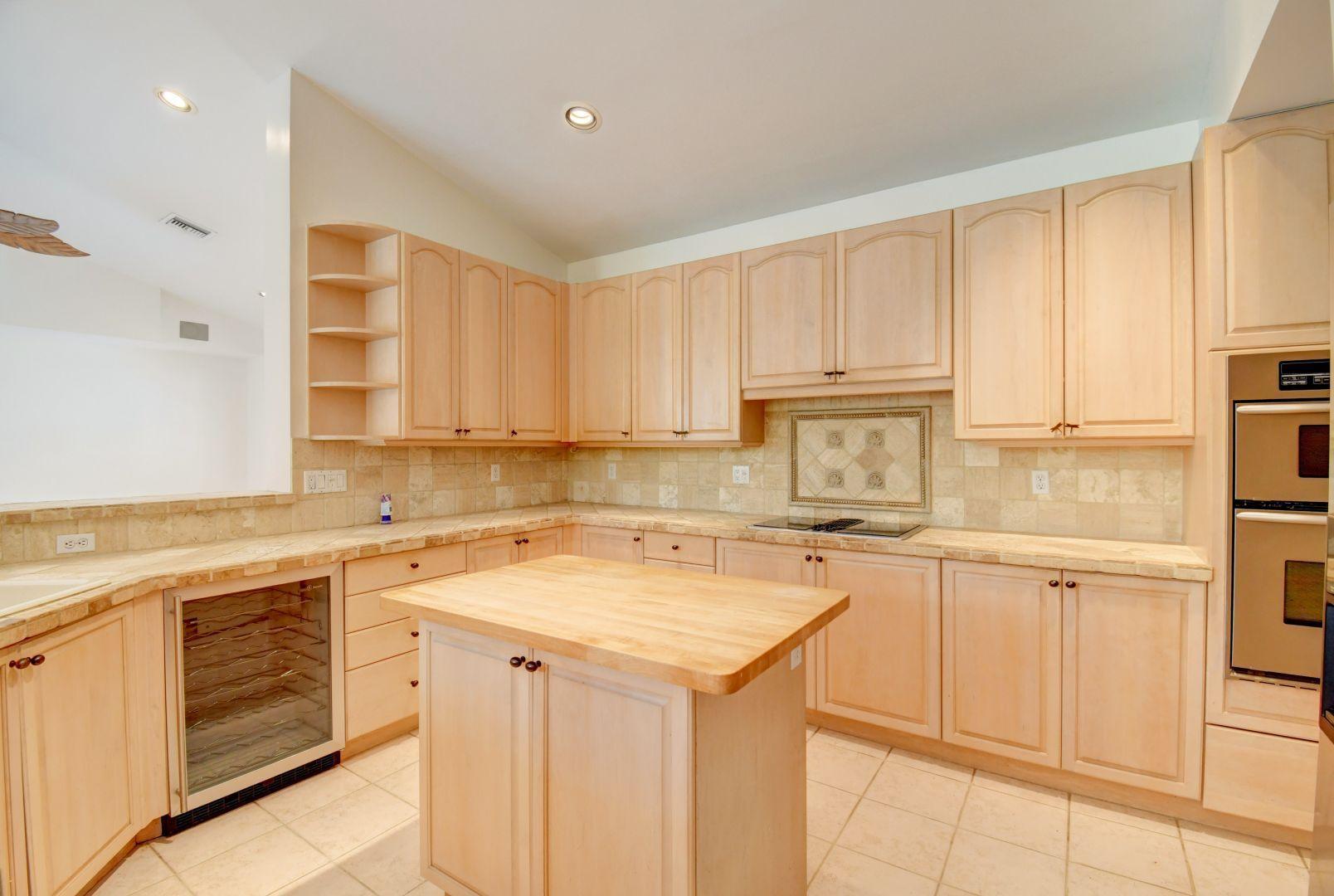 20710 Northwest 29th Avenue Boca Raton, FL 33434 - Photo 7 of 35 a kitchen with cabinets appliances a sink and a counter space