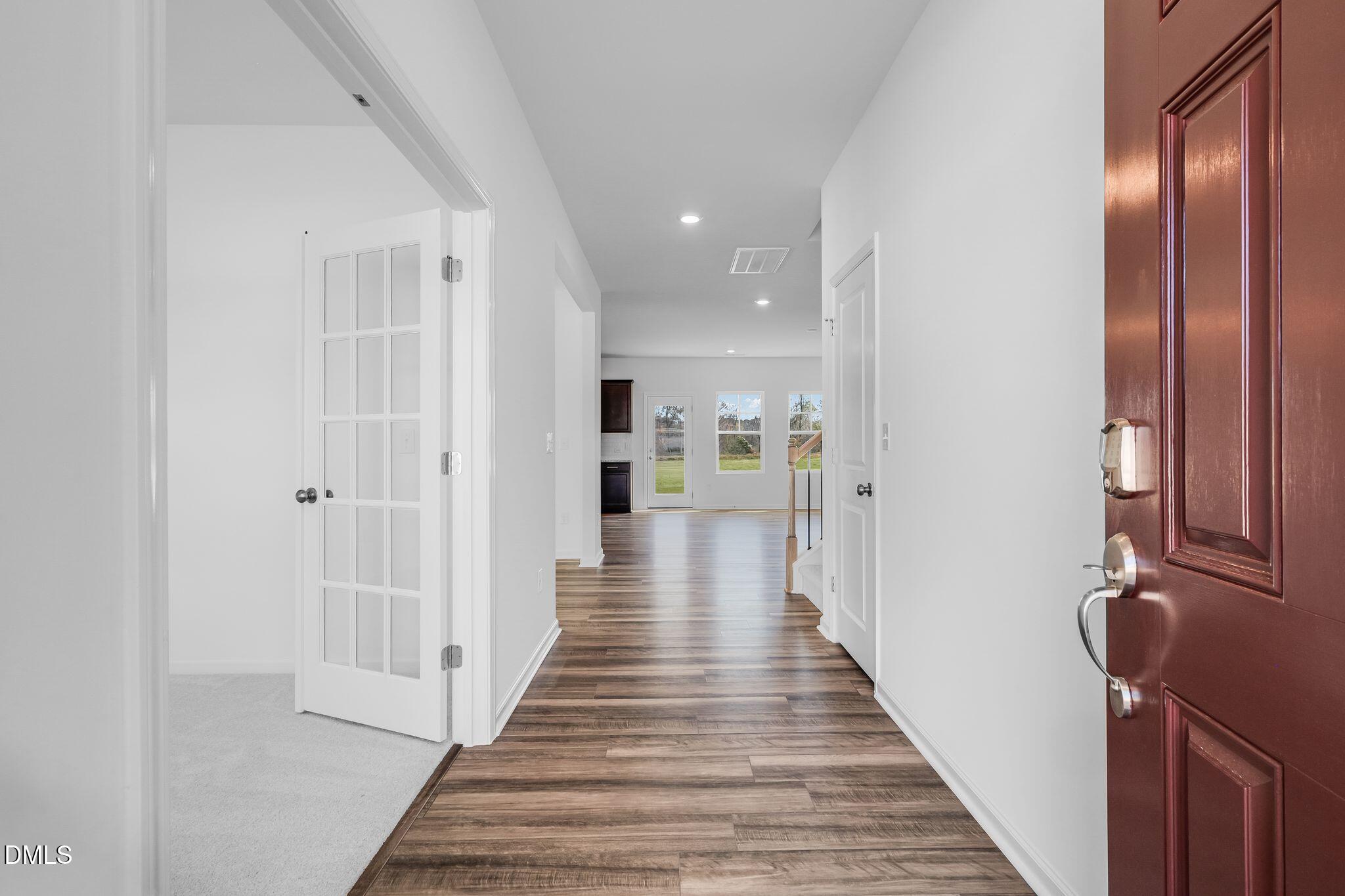 5818 Millstone Way Sims, NC 27880 - Photo 4 of 24 a view of a hallway with wooden floor