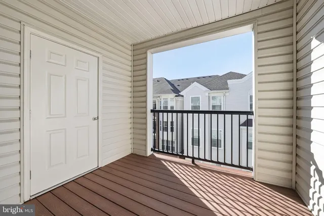 a view of a balcony with wooden floor