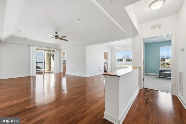 a view of kitchen with sink and wooden floor