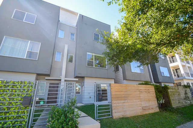front view of a house with a garden