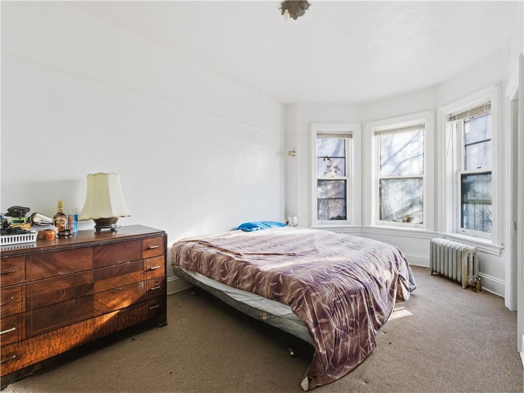 372 Parkside Avenue Brooklyn, NY 11226 - Photo 13 of 34 a bedroom with a bed and window
