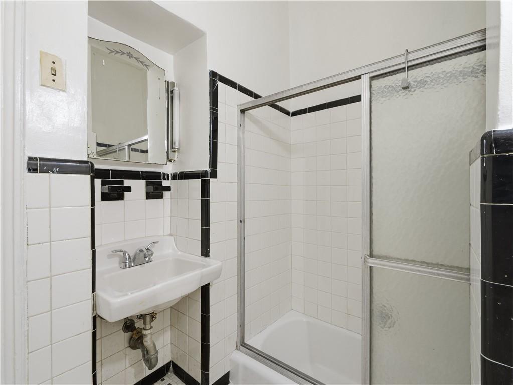 372 Parkside Avenue Brooklyn, NY 11226 - Photo 10 of 34 a bathroom with a shower and a sink