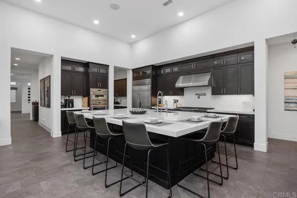 a kitchen with stainless steel appliances and cabinets