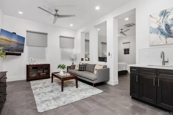 a bedroom with a bed and a night stand