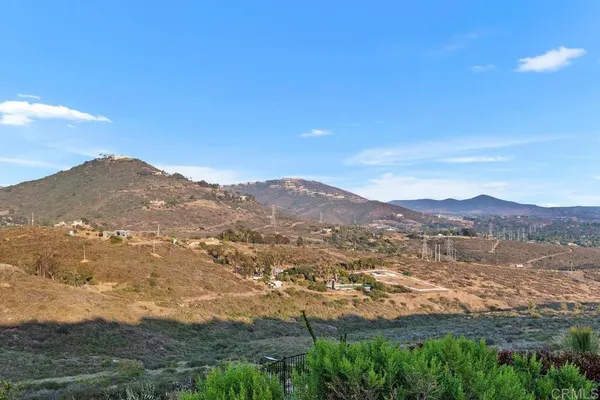 a living room with furniture and a garden