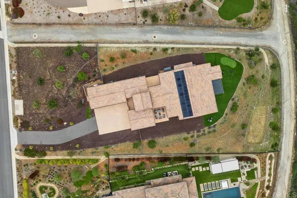 an aerial view of a house with a garden