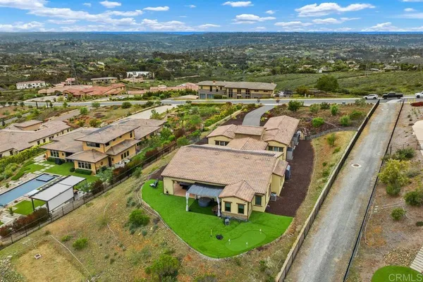 a view of an empty room with closet and a window