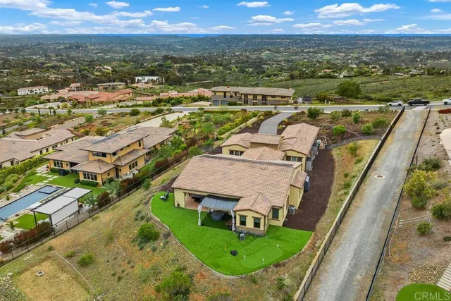 an aerial view of a house with a garden