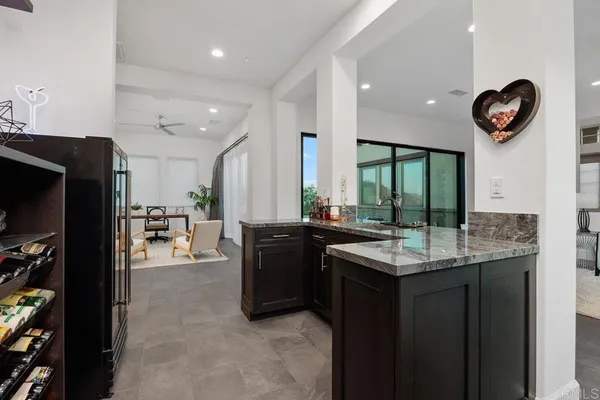 a kitchen with stainless steel appliances a sink and cabinets