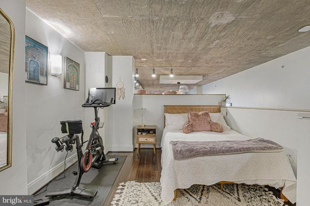 a bedroom with furniture and a view of bedroom