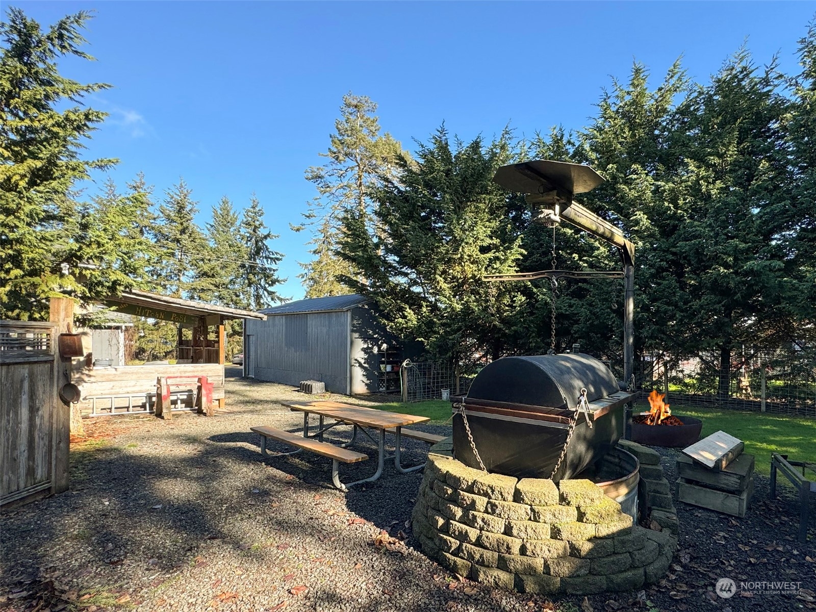 31 Daisy Lane Sequim, WA 98382 - Photo 26 of 40 a patio with table and chairs and potted plants