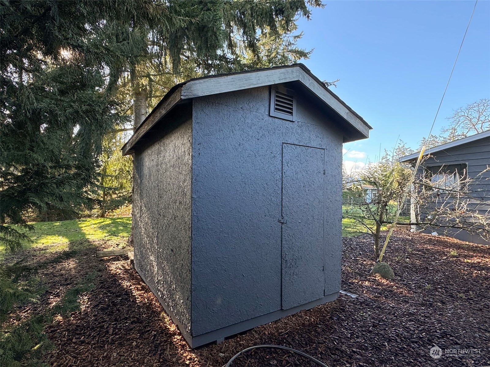 31 Daisy Lane Sequim, WA 98382 - Photo 40 of 40 a view of a wooden house with a yard