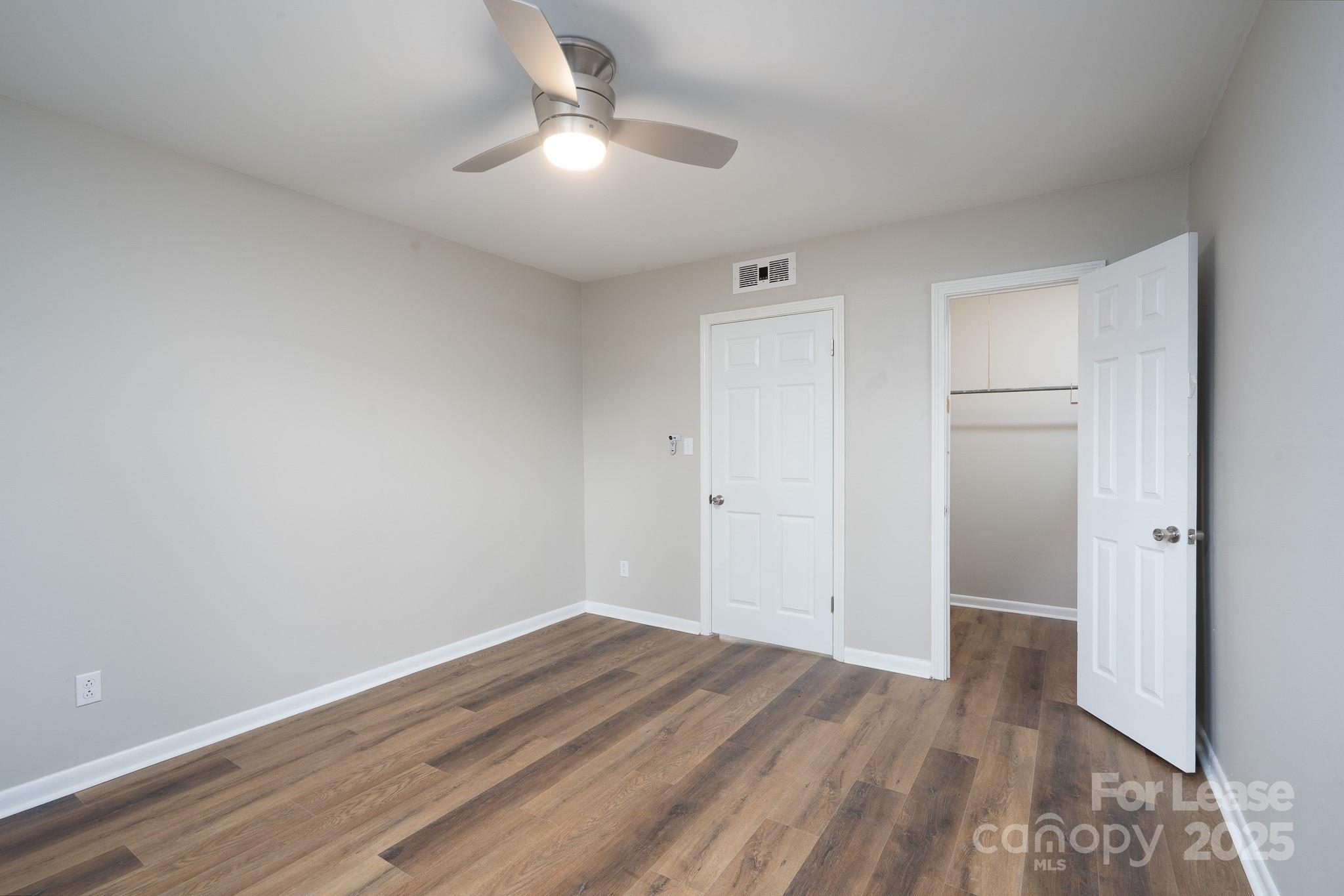745 Arbor Street Northeast, Unit 5 Concord, NC 28025 - Photo 13 of 20 wooden floor in an empty room