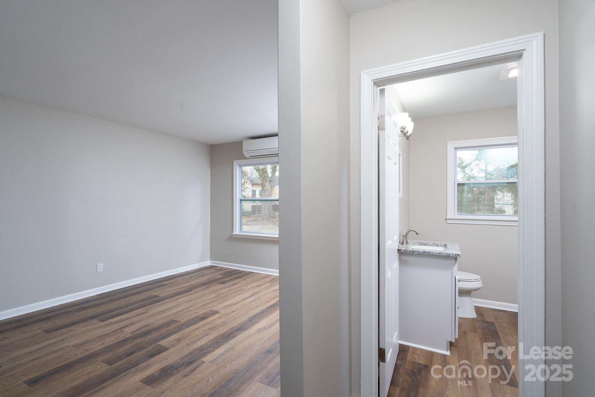 745 Arbor Street Northeast, Unit 5 Concord, NC 28025 - Photo 15 of 20 wooden floor in an empty room