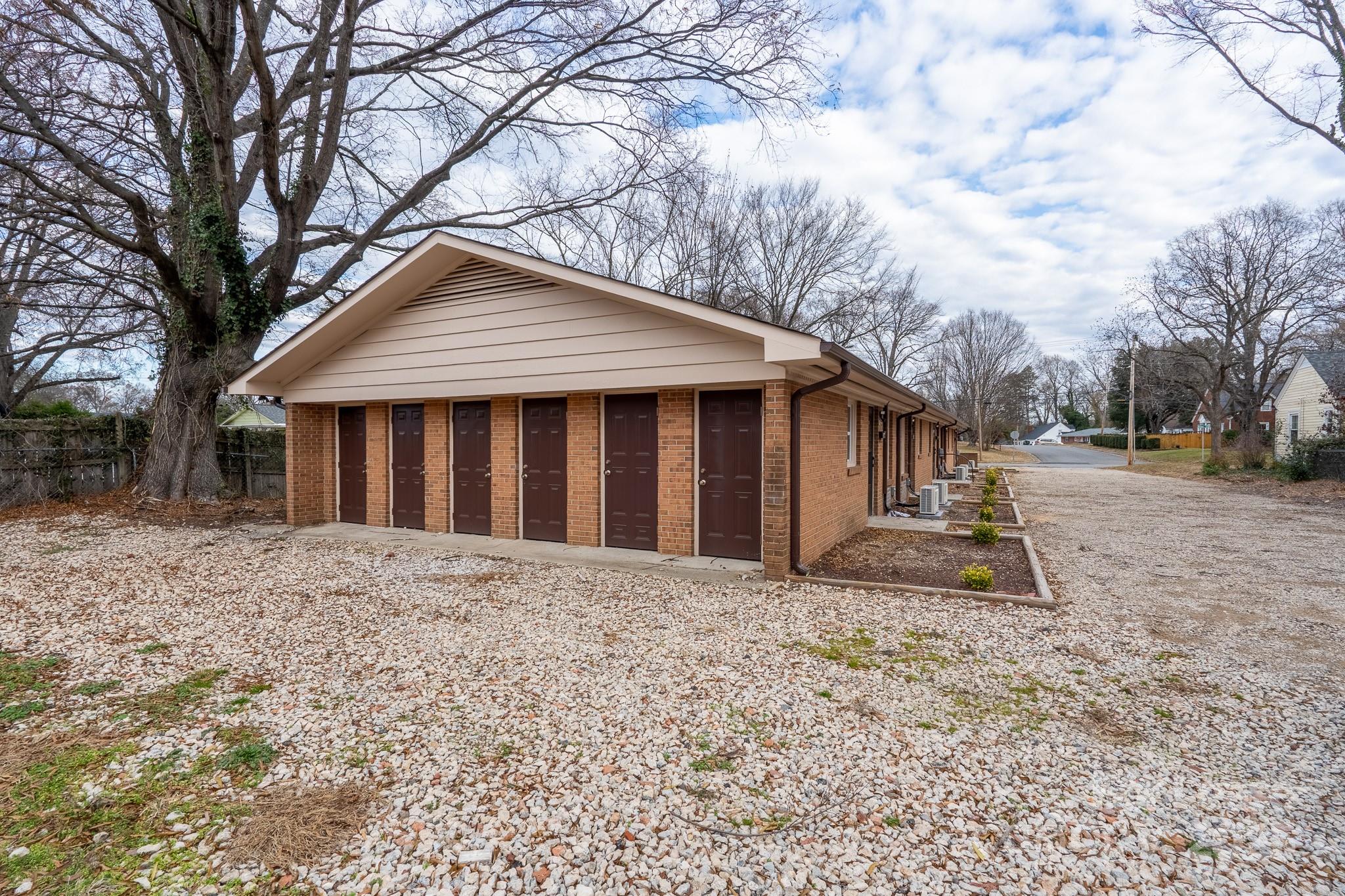 745 Arbor Street Northeast, Unit 5 Concord, NC 28025 - Photo 19 of 20 a house with trees in the background