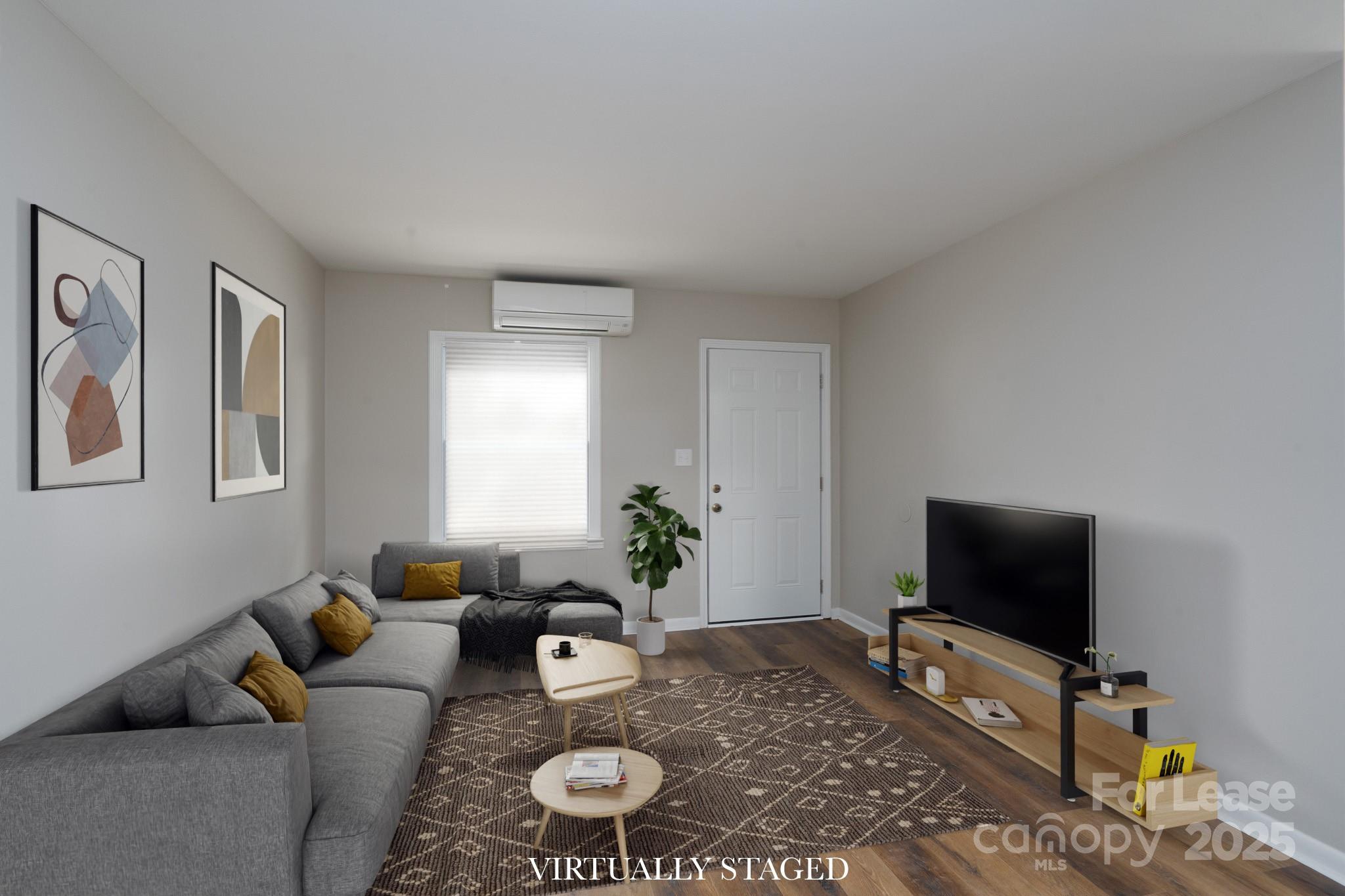 745 Arbor Street Northeast, Unit 5 Concord, NC 28025 - Photo 3 of 20 a living room with furniture and a flat screen tv